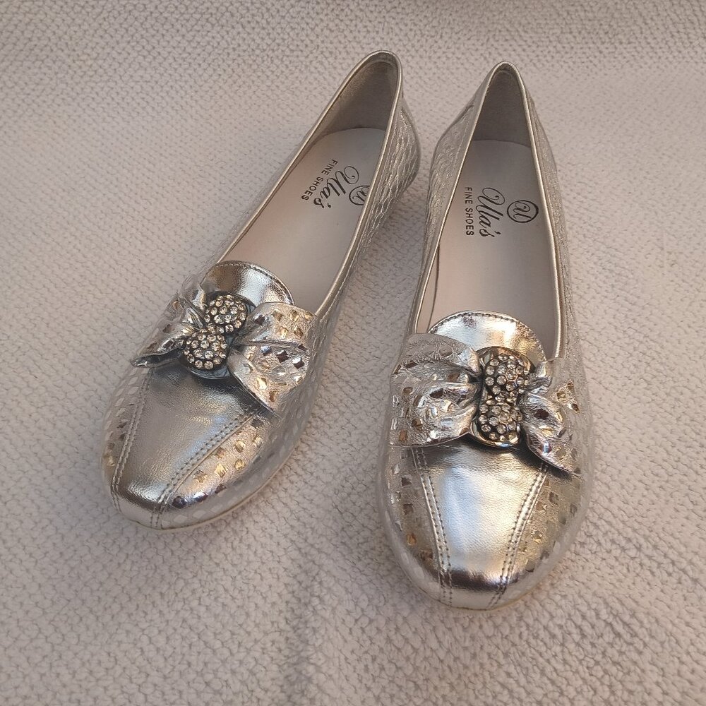Silver leather flats with diamond element.